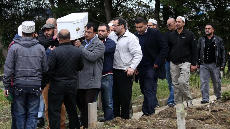 The remains of 2-year-old Hassan Khan are carried to the grave at Newcastle Cemetery at his funeral today. Photograph: Collins