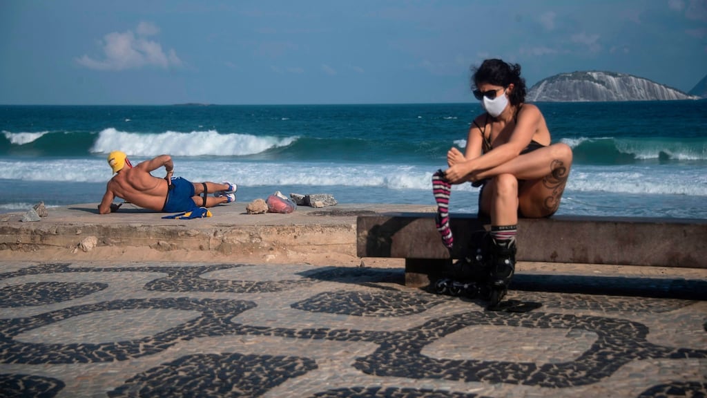 People exercise at the promenade of Ipanema beach in Rio de Janeiro state, Brazil. Photograph: Mauro Pimentel/AFP via Getty