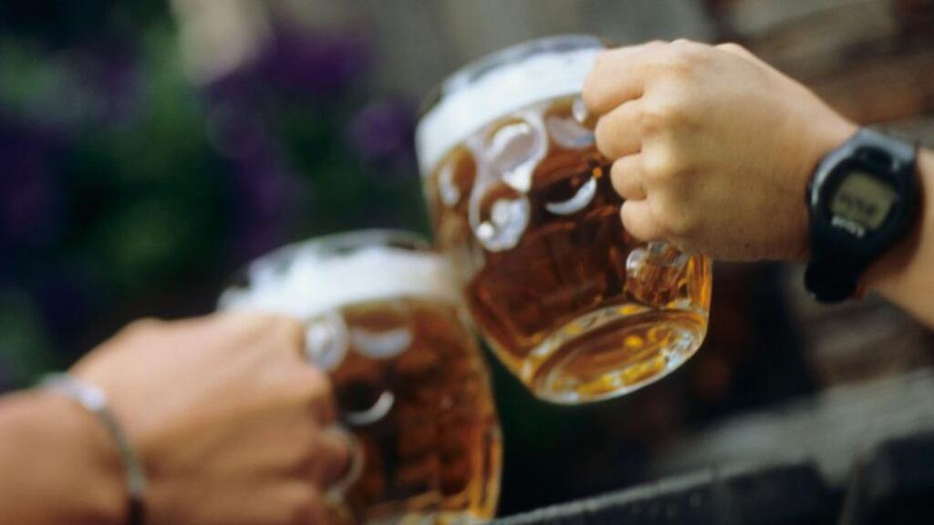 An uncle and nephew who robbed a bookmakers shop were arrested shortly afterwards as they sat in a nearby pub drinking pints, a court has heard.