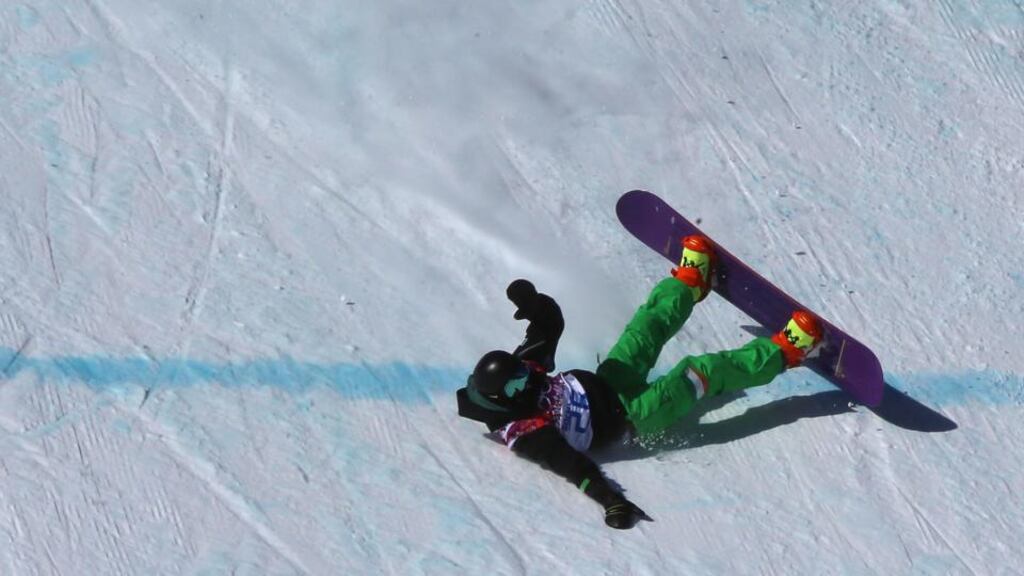 Seamus O’Connor fails to land his jump during the first run of his heat in the men‘s snowboard slopestyle qualification. Photograph: Jens Buettner/EPA