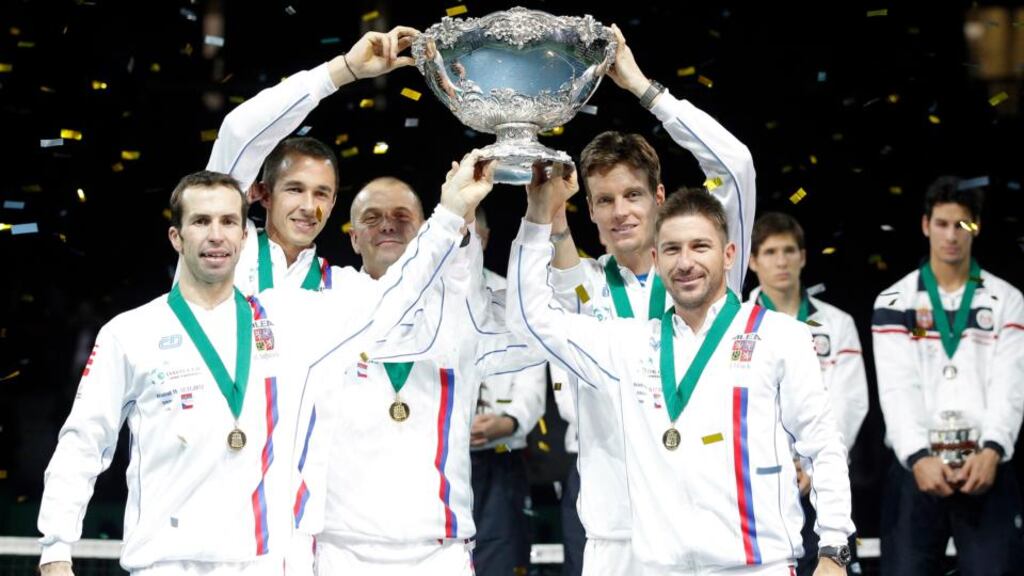 Left to right, Radek Stepanek, Lukas Rosol, team captain Vladimir Safarik, Tomas Berdych and Jan Hayek of the Czech Republic hold the winner’s trophy aloft after beating Serbia in the Davis Cup World Group Final at Kombank Arena in Belgrade, Serbia. Photograph: Srdjan Stevanovic/Getty Images.