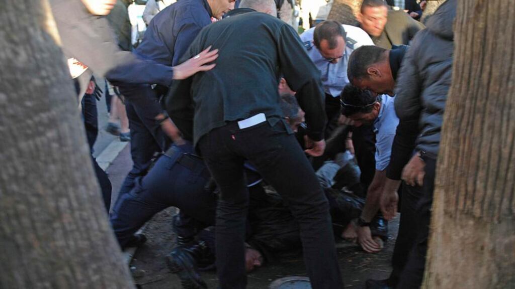 A man is detained by police and local security after shooting on the sidelines of the Cannes Film Festival yesterday evening. Photograph: Jonathan Gourdol/Reuters