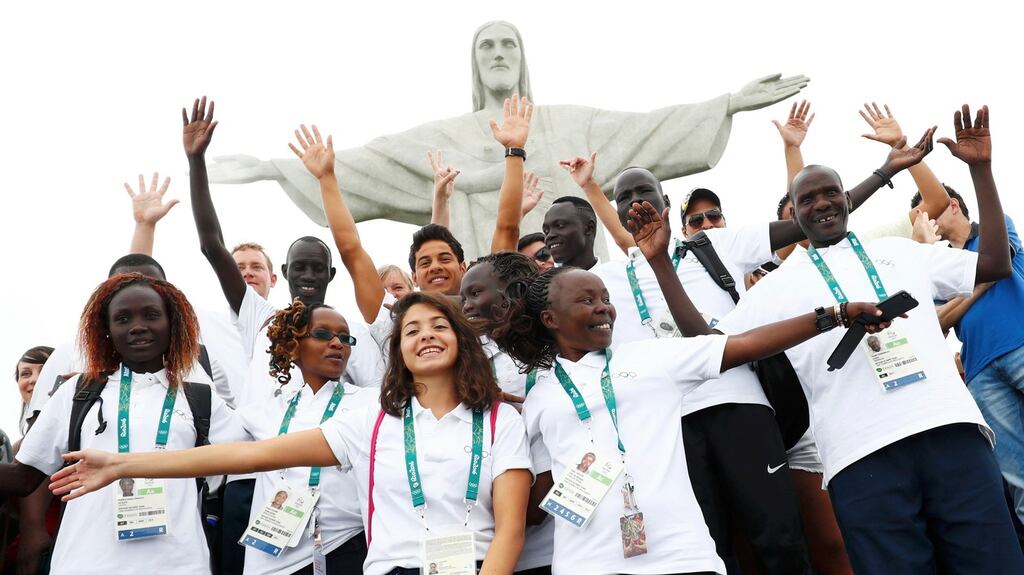 Members of the Olympic Refugee Team in front of Christ the Redeemer in Rio de Janeiro, Brazil. Photograph: Kai Pfaffenbach/Reuters
