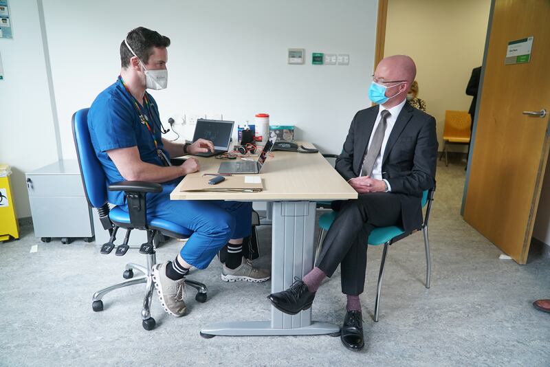 Consultant Matthew Barrett talks to Minister for Health Stephen Donnelly at the Bray Primary Care Centre.