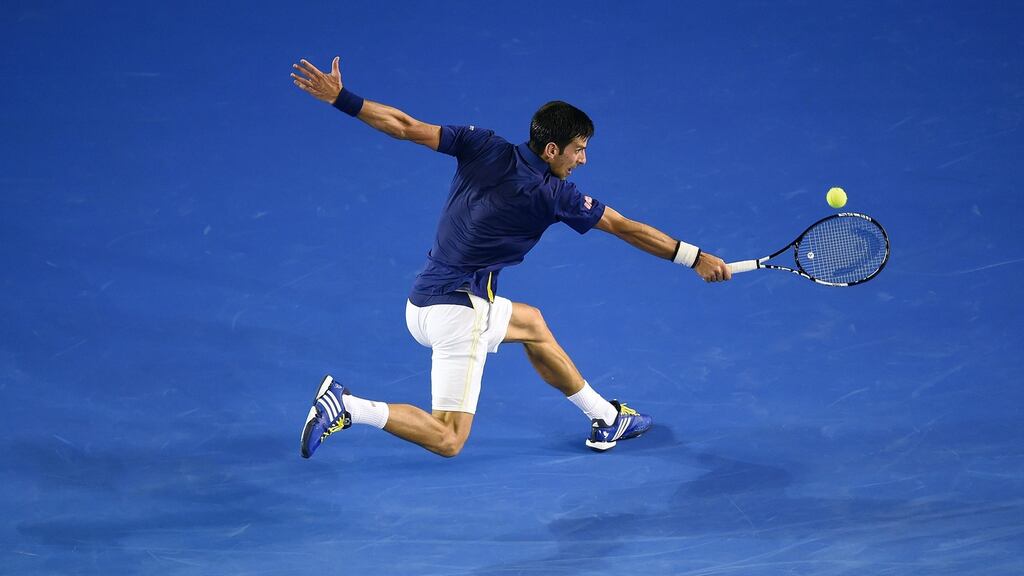 Novak Djokovic lunges for a return against Quentin Halys during their second round match at the Australian Open in Melbourne. Photograph: EPA