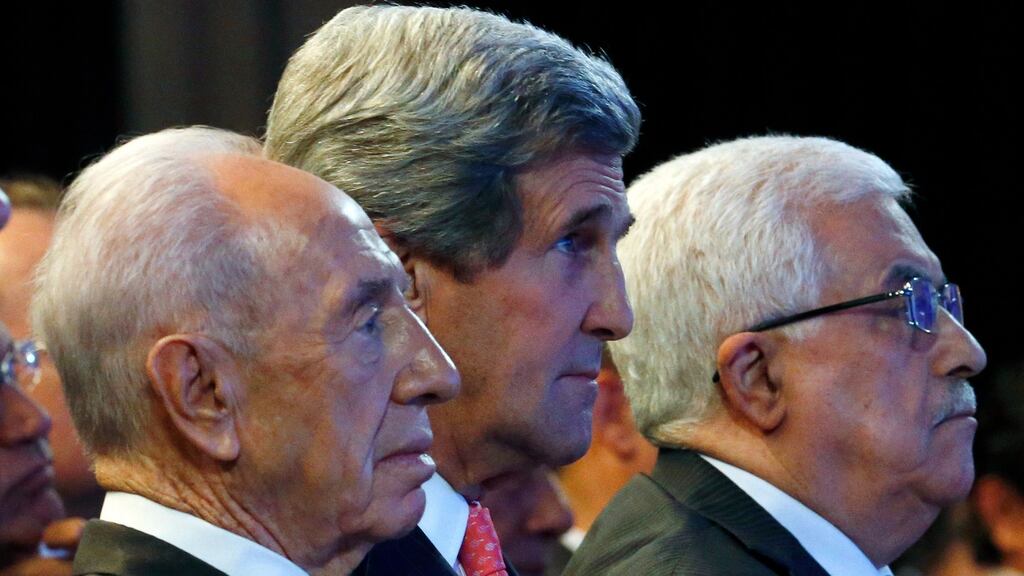 From left: Israeli president Shimon Peres, US secretary of state John Kerry and president Mahmoud Abbas of the Palestinian Authority during the World Economic Forum at the Dead Sea in Jordan. Photograph: Jim Young/New York Times.