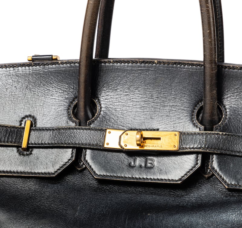 The well-worn original Birkin prototype features Jane Birkin's initials. Photograph: Sothebys