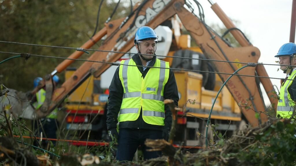 Taoiseach Leo Varadkar meets ESB Network workers in Kilcock, Co Kildare,  on Tuesday as they clear fallen power lines after Storm Ophelia. Photograph: Niall Carson/PA Wire