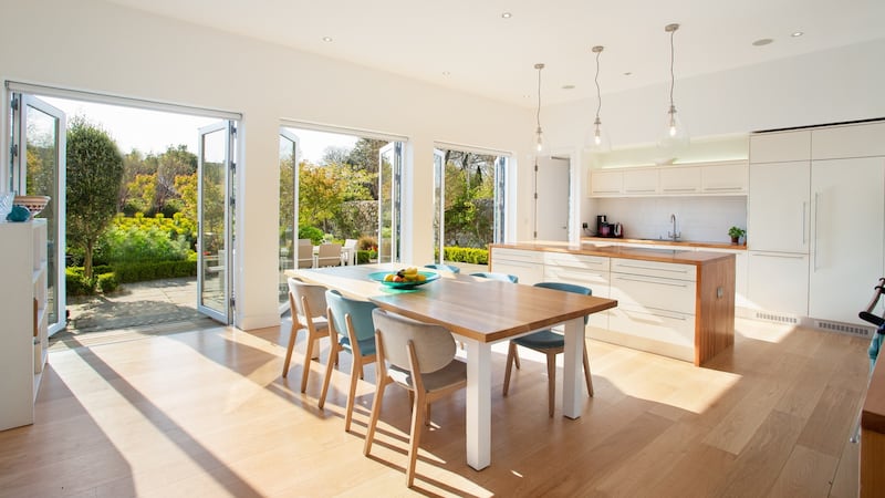 A bespoke Andrew Ryan kitchen is a welcoming space with a warm hardwood finish