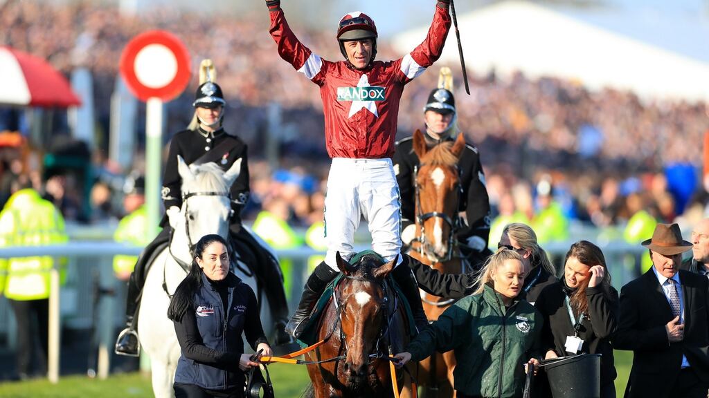 Jockey Davy Russell celebrates winning the Grand National on Tiger Roll for a second year at Aintree. Photograph: Mike Egerton/PA Wire