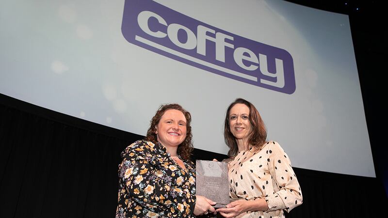 Dr Alison Connolly, Awards Judge, presents the Health & Safety Excellence Award - Construction award to Niamh McNulty, Coffey.