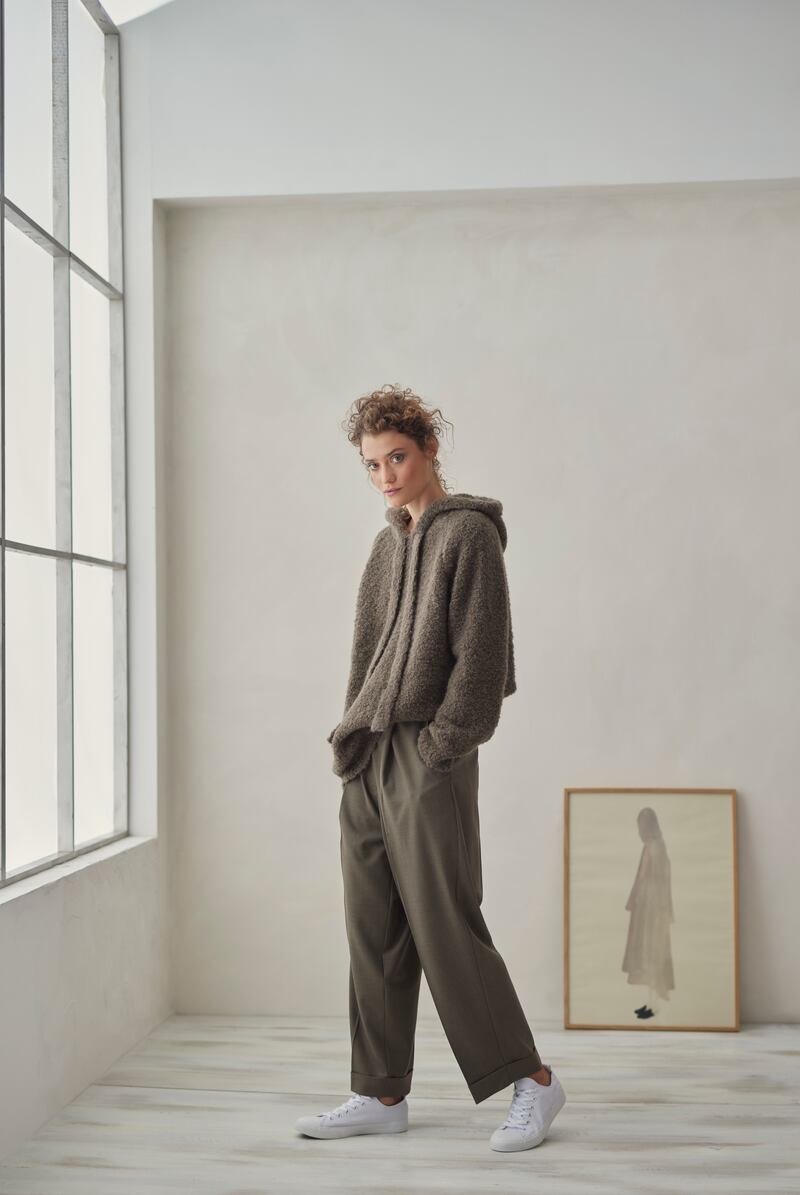 Hooded boucle knit sweater €325, fine wool masculine pant €295 by Cordera. Green Camisole print €110 by Paper Collective. Photograph: Dylan Madden