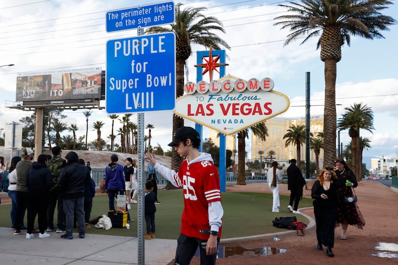 People gather at the Welcome to Fabulous Las Vegas sign in Las Vegas, Nevada. The AFC champion Kansas City Chiefs will face the NFC champion San Francisco 49ers in Super Bowl LVIII at the Allegiant Stadium in Las Vegas on February 11th.