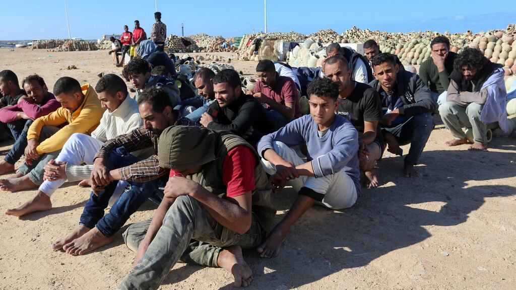 Migrants rescued by Tunisia’s national guard during an attempted crossing of the Mediterranean by boat, rest on the beach at the port of el-Ketef in Ben Guerdane in southern Tunisia near the border with Libya, on December 15th. Photograph: Fathi Nasri/AFP via Getty
