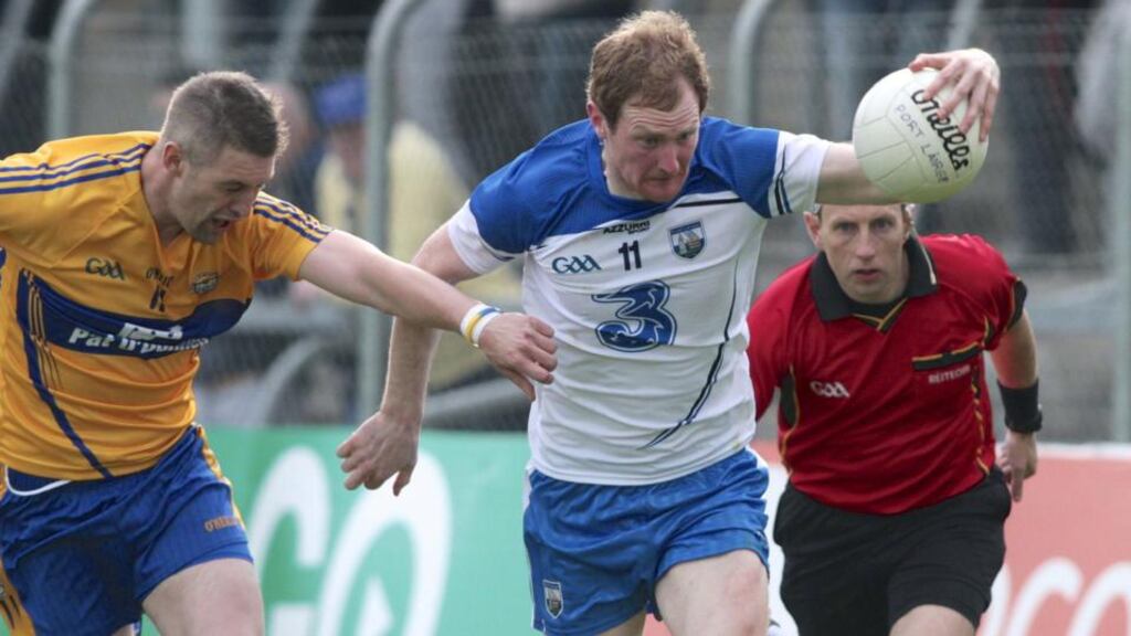 Enda Coughlan of Clare and Waterford’s Liam Ó Lonáin. Photograph: Inpho