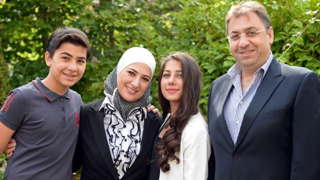 Modar Naser from Syria, with his wife, Dima, and their children, Naser (15) and Kamar (17), at home in Lucan, Co Dublin. Photograph: Eric Luke