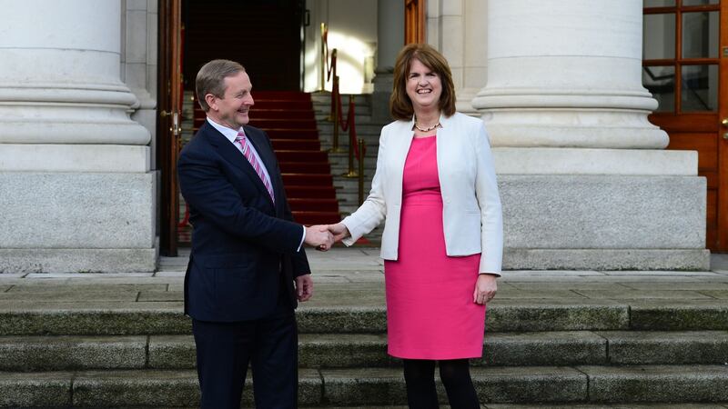 Taoiseach Enda Kenny and Tanaiste Joan Burton outside Government Buildings before he left for Aras an Uachtarain, where President Michael D Higgins dissolved the Dail. Photograph: Dara Mac Dónaill / The Irish Times