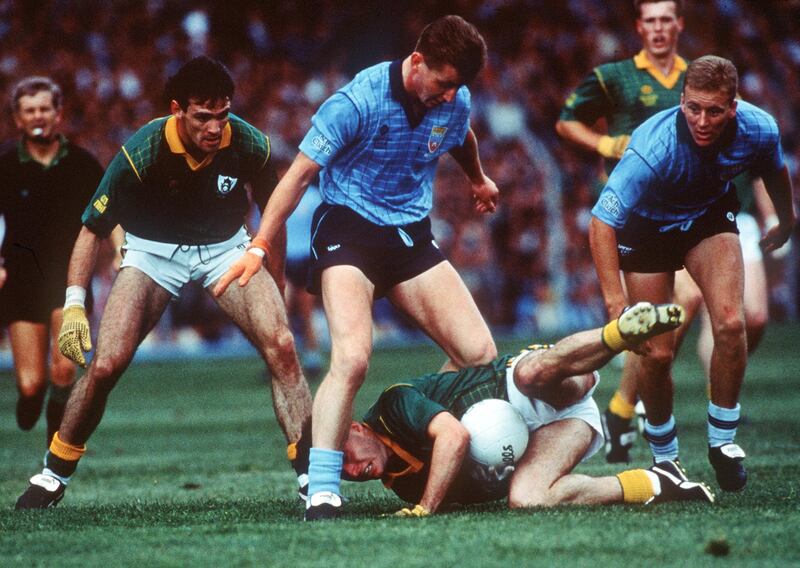 Dublin's Eamonn Heery stands over the David Beggy of Meath in the 1990 Leinster football final. Photograph: Billy Stickland/Inpho