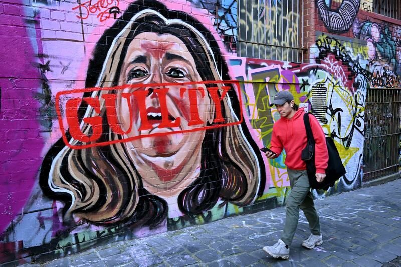Mural by street artist Jarrod Grech of Erin Patterson - now stamped with a guilty sign - after she was found guilty of murdering three members of her husband's family with a toxic mushroom-laced beef Wellington lunch. Photo by William West/AFP)