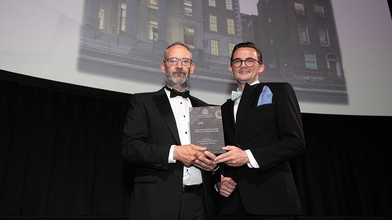 Noel McKernan, General Manager, HALT, presents the Conservation Award for a Single Building or Development (Large) award to John Dobbin, Shay Cleary Architects.