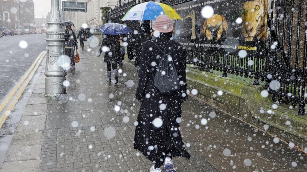 As Dubliners and others along the east coast shivered in intermittent snow showers, Met Éireann said the likelihood was for continuing very cold conditions but not widespread snow. Photograph: Dave Meehan