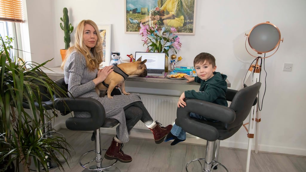 Cheryl Baker with her four-year-old son, Conor, in their Co Waterford home. ‘The only way to escape being poor is to get a really good, well-paid job,’ says the single mother who is studying for a master’s. Photograph: Patrick Browne