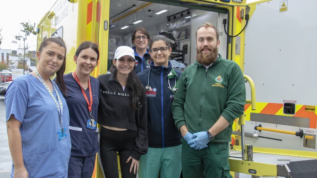 Kirstin Chadwick (centre) with University Hospital Galway staff preparing for the departure of the ambulance carrying her partner James Martin to Shannon Airport.