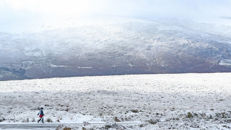A walker enjoys the snow in the mountains near Killakee, to the south east of Dublin. Photograph : Niall Carson/PA Wire