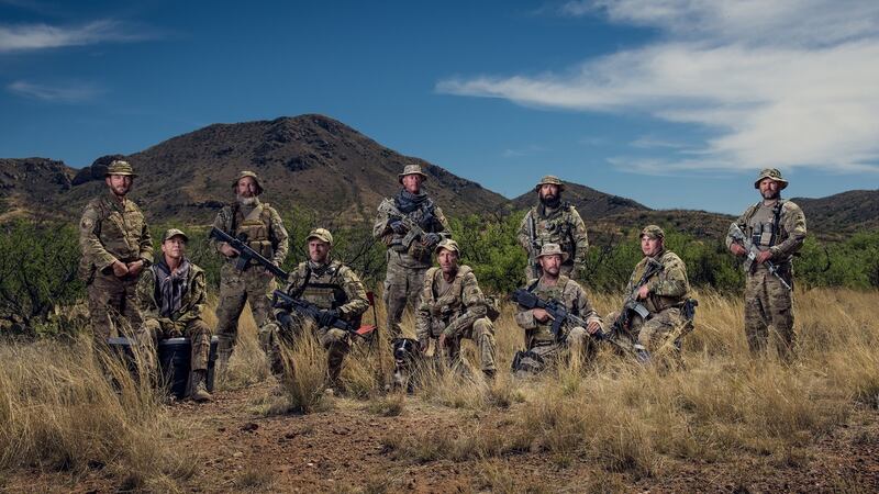 Members of the Arizona Border Recon group, with self-described “extremist” Tim “Nailer” Foley kneeling in centre