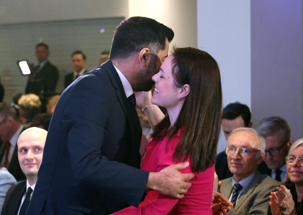Humza Yousaf and his leadership rival Kate Forbes hug at Murrayfield Stadium in Edinburgh after he was announced as the new leader of the Scottish National Party. Photograph: Robert Perry/EPA