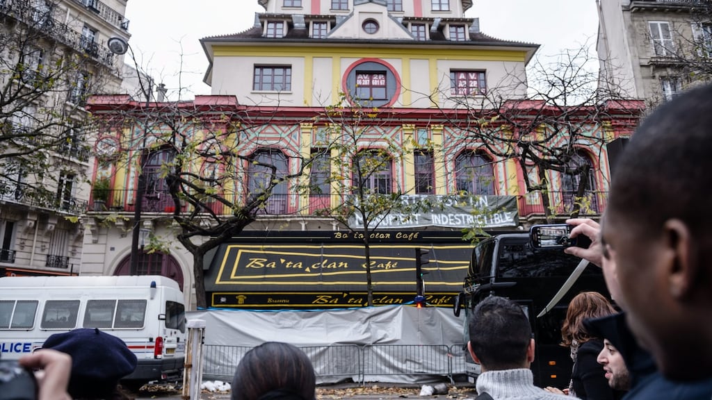 People look at the facade of the Bataclan theatre after police reopened traffic on the Boulevard Voltaire in Paris, France. Photograph: Christophe Petit Tesson/EPA