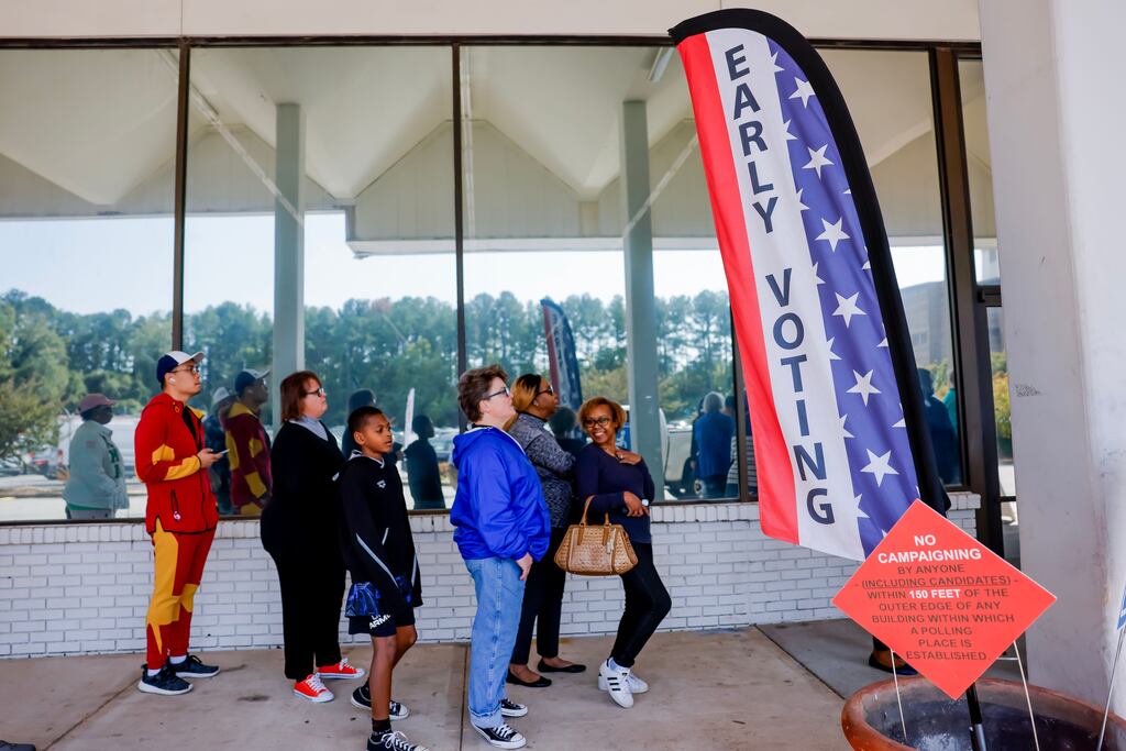 People queue to cast ballots in Dekalb County, Georgia, where early voting for the US presidential election opened last week. A record 310,000 votes were cast on day one. Photograph: Erik S Lesser/EPA
