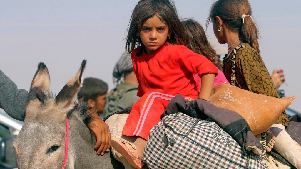 Displaced children from the Iraqi minority Yazidi sect, fleeing Islamic State terrorists in Sinjar in 2014. Photograph: Reuters