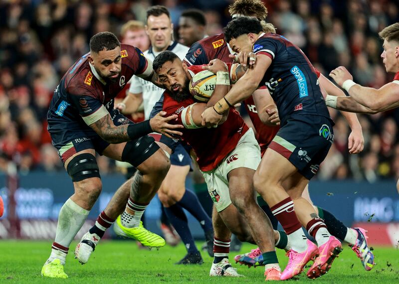 Bundee Aki is tackled by Lukhan Salakaia-Loto and Hunter Paisami. Photograph: Dan Sheridan/Inpho