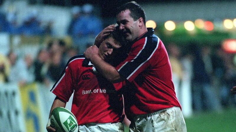 Ronan O’Gara celebrates with Anthony Foley after scoring his try in a Heineken Cup game against Castres in 2000. Photograph: Billy Stickland/Inpho