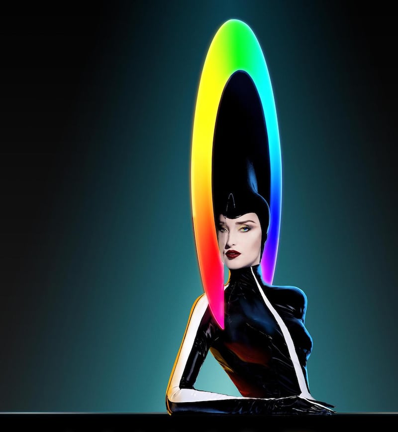 Vivid: Philip Treacy’s headpieces for the kick-line dancers change colour