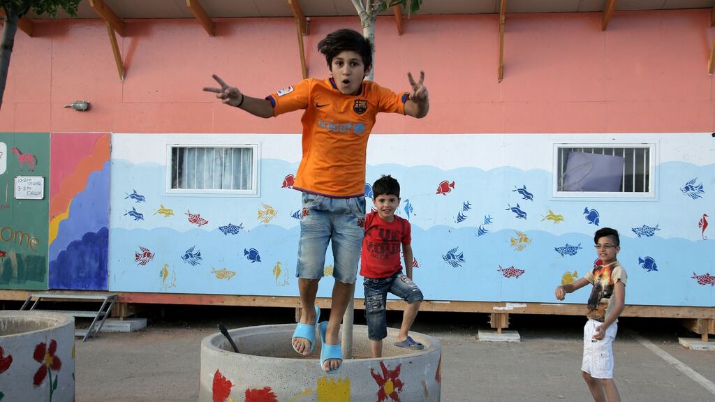Skaramagas: boys play in a kindergarden at the refugee camp near Athens. Photograph: Panayotis Tzamaros/NurPhoto via Getty