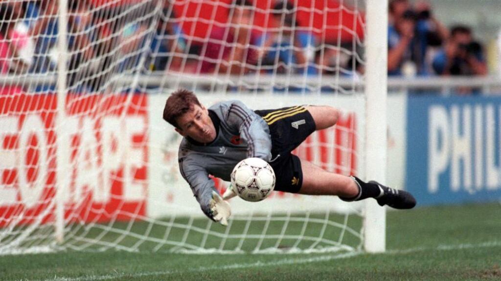 Packie Bonner makes his save during the shootout against Romania. Photograph: Billy Stickland/Inpho