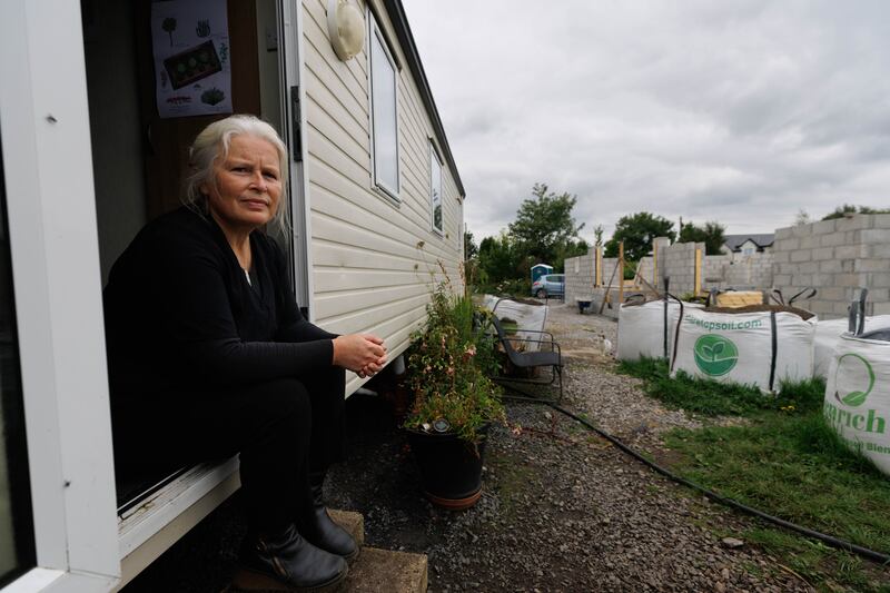 Martina Cleary with her home under construction near Crusheen, Co Clare. Photograph by Eamon Ward