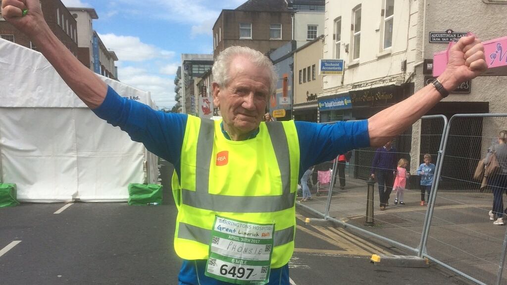 Phonsie Clifford (86) after crossing the finish line of the 10km event in the Barringtons Hospital Great Limerick Run on Sunday. Photograph: David Raleigh