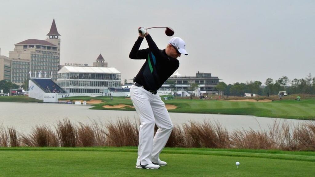 Simon Dyson hits his tee-shot on the 18th hole at the BMW Masters at Lake Malaren Golf Club. Photograph: Andrew Redington/Getty Images