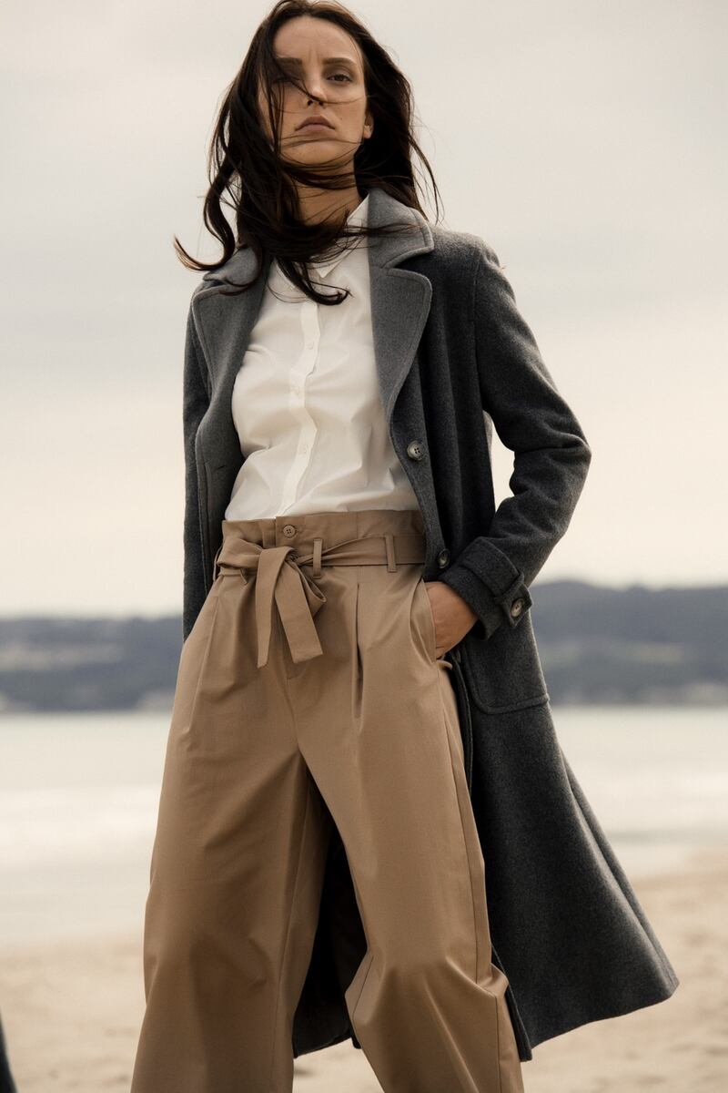 Grey oversize coat €199, white shirt €89, trousers €99