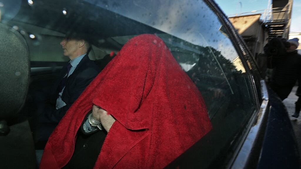 Niall Power, (covered by red towel) a 45-year-old married father of four of Gyles Quay, Riverstown, Dundalk being taken from Dundalk District Court last week. Photograph: Colin Keegan, Collins Dublin.