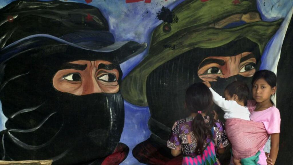 Faces of resistance: a mural of Zapatista rebels. Photograph: Susana Gonzalez/Newsmakers