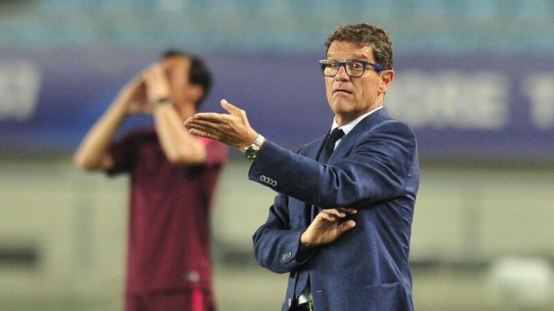 Chinese Super League: Fabio Capello’s jeans and matching blue glasses caused quite a stir when he arrived in Nanjing. Photograph: VCG via Getty