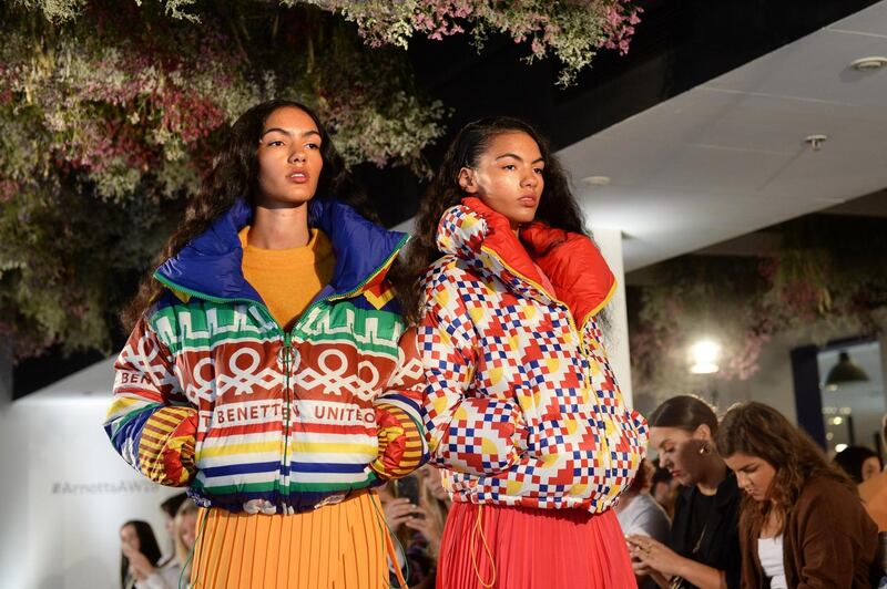 Arnotts AW2019: Cadhla wears yellow InWear Cree knitwear, €130; yellow Set pleated skirt, €80; patterned Benetton puffa jacket, €189; green Falke knee-highs, €10; and neon green Steve Madden chunky trainers, €120. Sadbh wears pink Set knitwear, €160; pink Set pleated skirt, €119; Benetton pattern puffa jacket, €189; purple Falke knee-highs, €10; pink Ash chunky trainers, €269. Photograph: Dara Mac Dónaill