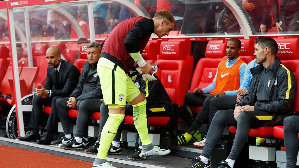 Manchester City’s Joe Hart on the substitutes bench at Stoke. Photograph: Carl Recine/Reuters