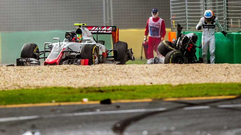 Fernando Alonso walks away from the wreckage of his McLaren-Honda after it crashed during the Australian Grand Prix in Melbourne. Photograph: Srdjan Suki/EPA