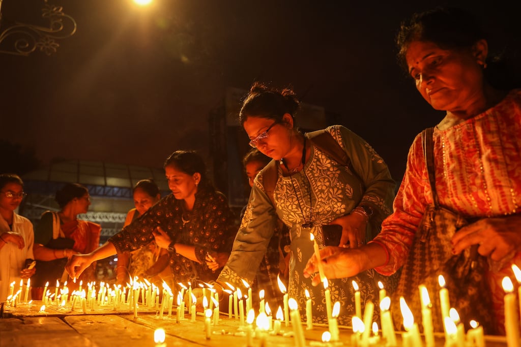 Medical practitioners and citizens attend a candle light vigil to protest against a rape and murder incident at RG Kar Medical College in Kolkata. Photograph: Divyakant Solanki/EPA
