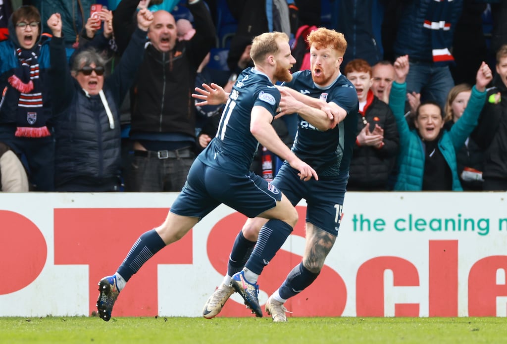 Ross County's Josh Sims (left) celebrates scoring his side's third goal during the Scottish Premiership match against Rangers at the Global Energy Stadium. Photograph: Steve Welsh/PA Wire